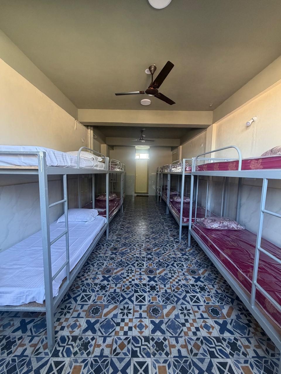 Dormitory with rows of bunk beds at Sala Stay In, Belur